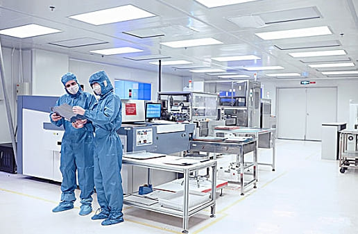 cleanroom personnel with PPE